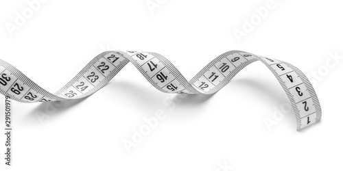 Measuring tape on white bac...