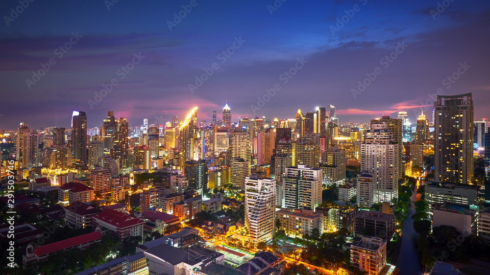night cityscape lighting up and twilight skyline in metropolis