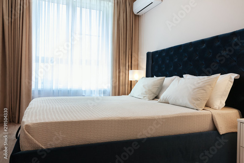 Modern bedroom with window and curtains