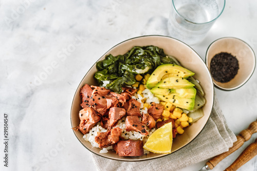 Vegan healthy bowl with rice, salad and jackfruit on dark backround