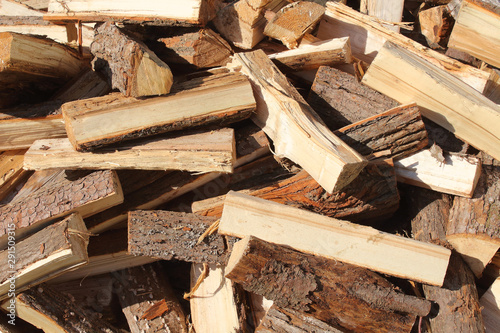 A pile of chopped firewood. Close-up. Background. Texture.