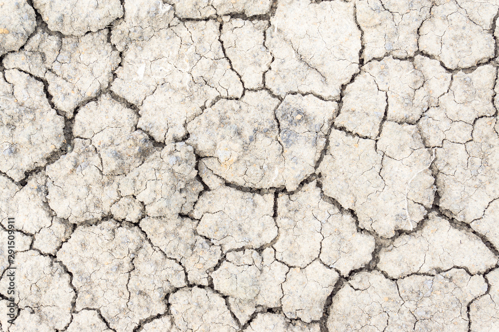 Crack soil on dry season, Global warming / cracked dried mud / Dry cracked earth background / The cracked ground, Ground in drought, Soil texture and dry mud, Dry land. Crack soil on dry season, Global warming / cracked dried mud / Dry cracked earth background / The cracked ground, Ground in drought, Soil texture and dry mud, Dry land.