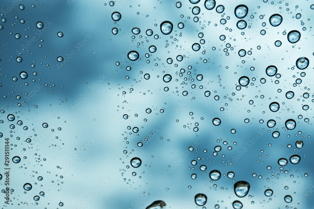 Rain on the window, natural skin of the rain The natural form of rainwater on a sky background. Rain on the window, natural skin of the rain The natural form of rainwater on a sky background.