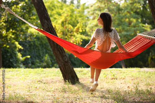 Happy young woman sitting i...