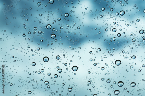 Rain on the window, natural skin of the rain The natural form of rainwater on a sky background.