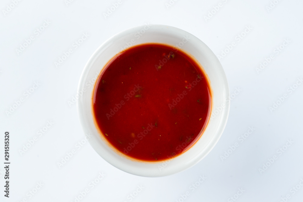 tomato ketchup sauce in a bowl on a light background tomato ketchup sauce in a bowl on a light background