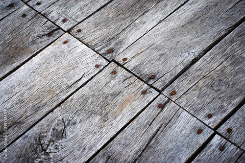 Detail of an old wooden slab floor with nails