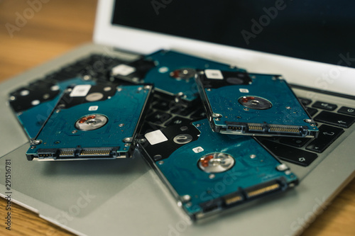 Harddrives laying on top of laptop
