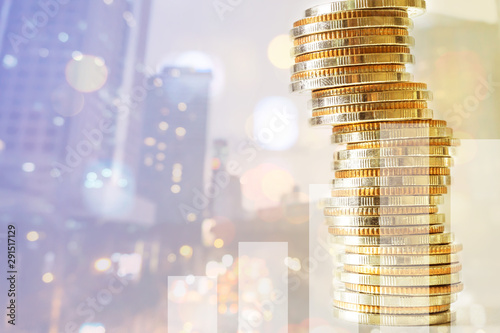 Concept of currency trading, making a decision for an optimal gain. Graph and rows of coins for finance and business concept.