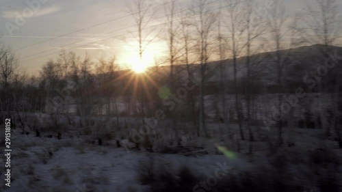 Lockdown: Sun Rising Behind the Snow Covered Area and Surrounded by Trees - Trans-Siberian Railway, Russia