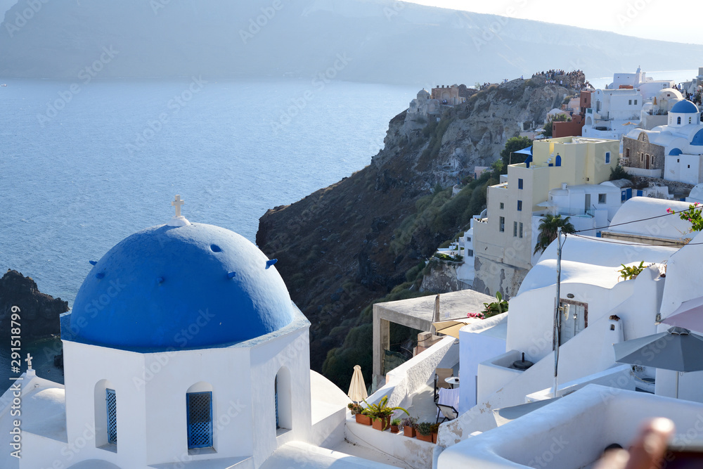 Fototapeta premium Blue and white church and Aegean Sea on Santorini island, Greece