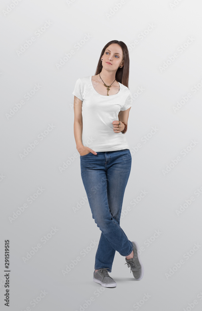 Female model wearing white plain t shirt in blue denim jeans pant. Female model wearing white plain t shirt in blue denim jeans pant.