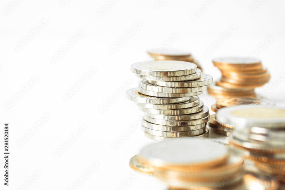 Coins stacked on each other in different positions. Saving money and account finance bank business concept. Business Finance and Money concept,Save money for prepare in the future.time is money concep Coins stacked on each other in different positions. Saving money and account finance bank business concept. Business Finance and Money concept,Save money for prepare in the future.time is money concep