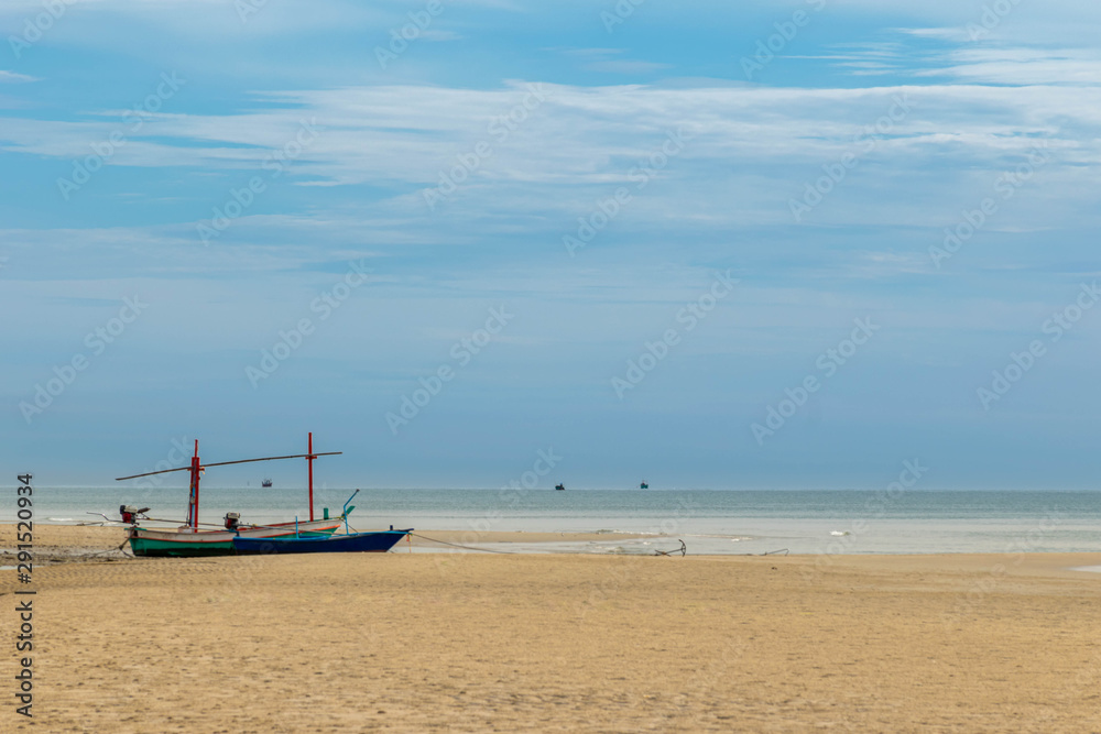 Small fishing boats park on the beach