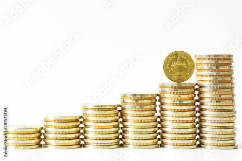 Coins stacked on each other in different positions. Saving money and account finance bank business concept. Business Finance and Money concept,Save money for prepare in the future.time is money concep