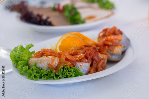 Kashubian-style herring. Herring with onion with tomatos souce.