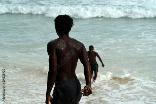 MAHE, SEYCHELLES - AUGUST 13 2019 - Young creole people having fun on the beach photo