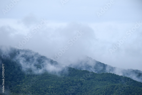 Beautiful Landscape of mountain layer in morning sun ray and fog, Misty landscape with mountain in the morning