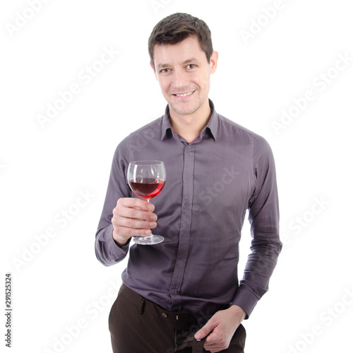 Young attractive man drinks red wine.