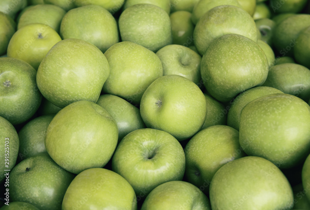 Fresh green apples close up at the market. Healthy food background concept Fresh green apples close up at the market. Healthy food background concept