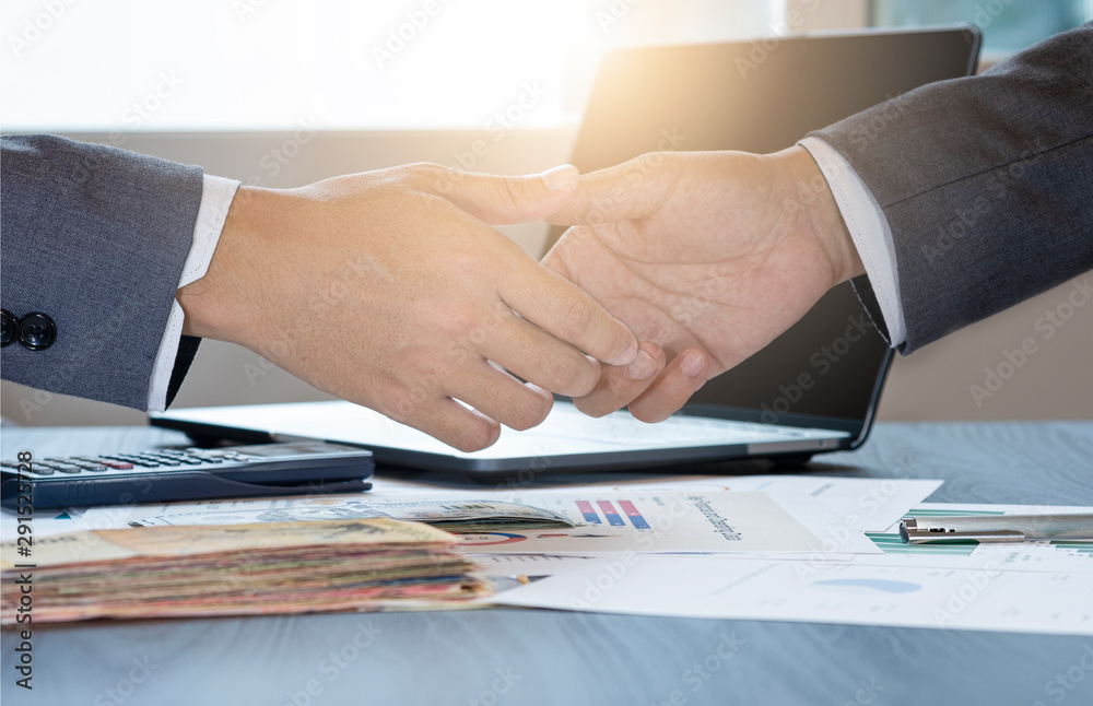 Businessman gesture shaking hand for successful dealing negotiation. They achieve and enjoy with marketing business meeting between supplier and customer. Businessman gesture shaking hand for successful dealing negotiation. They achieve and enjoy with marketing business meeting between supplier and customer.