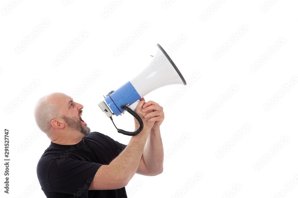 Portrait of angry man shouting with a megaphone. Bearded man yelling into a megaphone, isolated. Copy space for your text Portrait of angry man shouting with a megaphone. Bearded man yelling into a megaphone, isolated. Copy space for your text