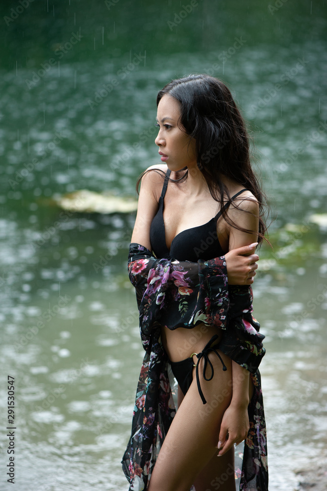 Beautiful young slim asian woman in bikini