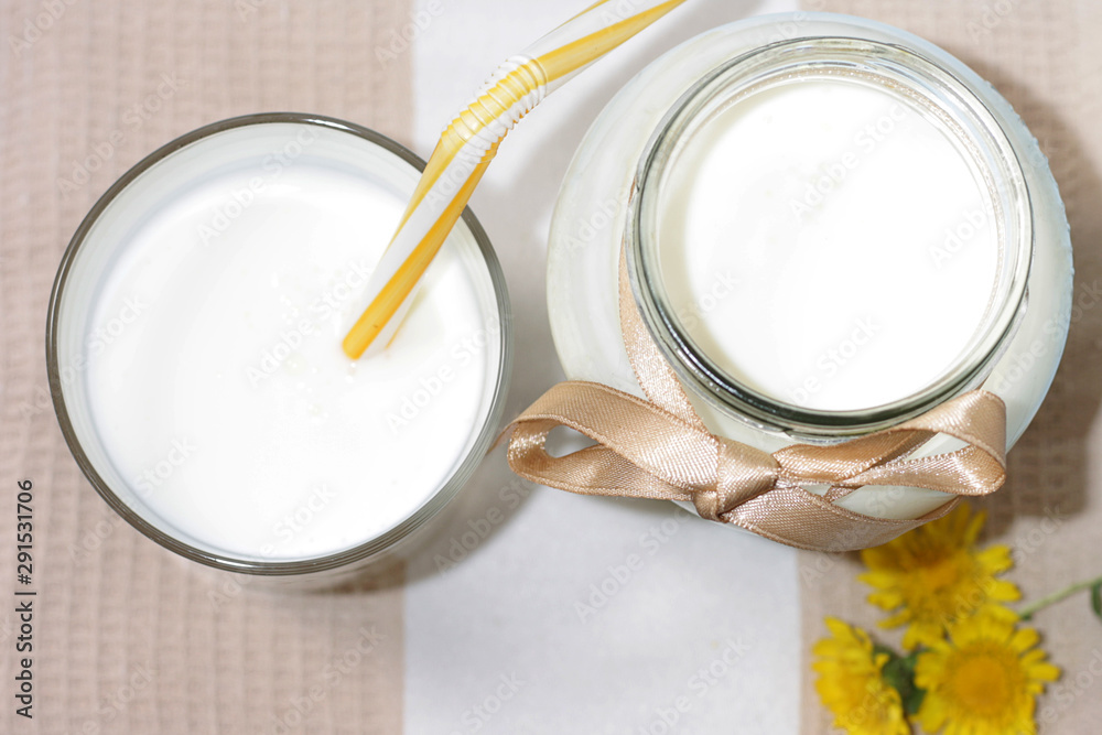 Ayran, homemade yogurt drink kefir, lassi - healthy summer refreshing cold drink on blue table.