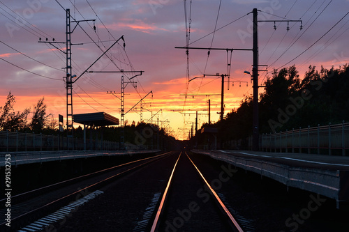 railway track , sunset as background
