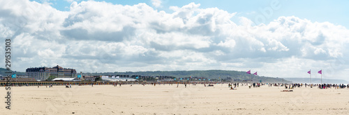 panorama of the expansive sandy beaches at Deauville in Normandy on a beautiful summer day