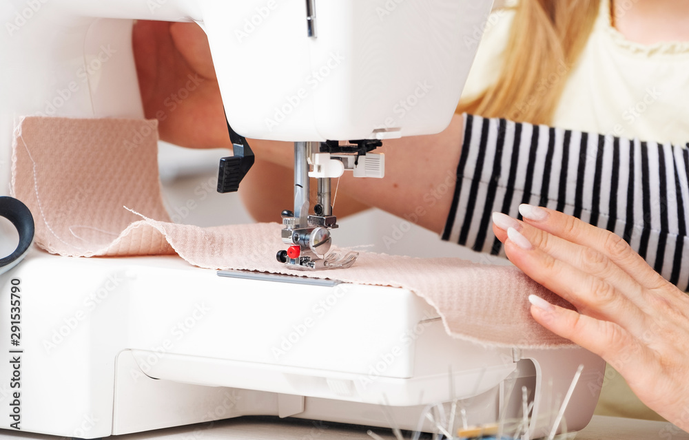Hard process of sewing at stationar machine, closeup