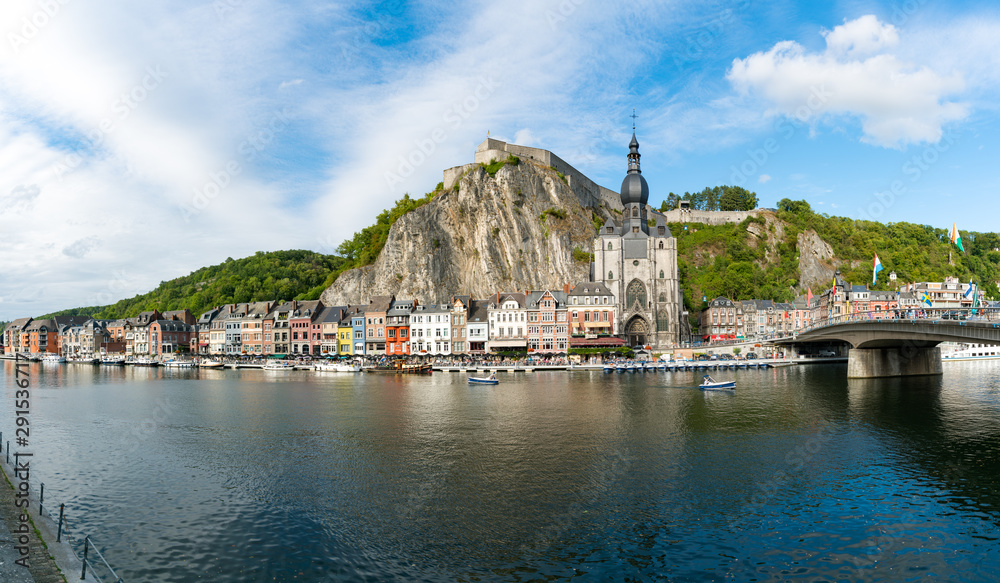 Naklejka premium horizontal view of the Meuse River and the historic old riverside town of Dinant in Belgium
