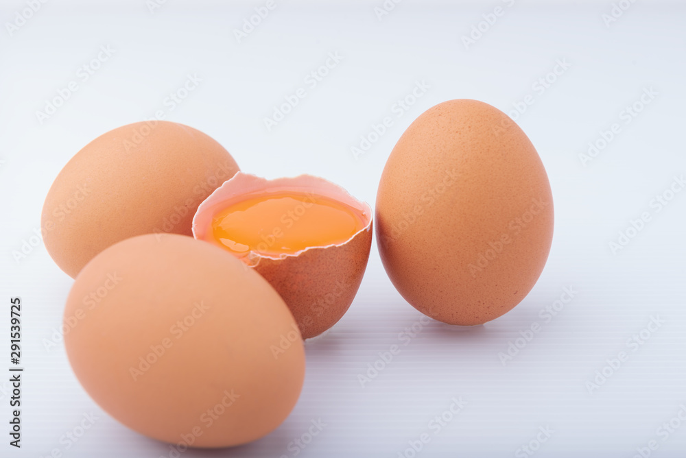 Broken brown eggs on the White Blackground. Broken brown eggs on the White Blackground.