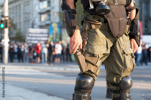 Armed riot police officer on duty during street protest