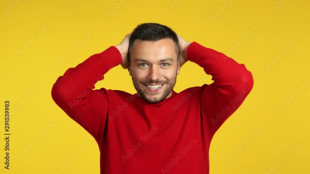 Surprised amazing man on yellow background Surprised amazing man on yellow background