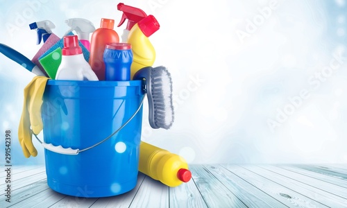 Plastic bottle, cleaning sponge and gloves  on background
