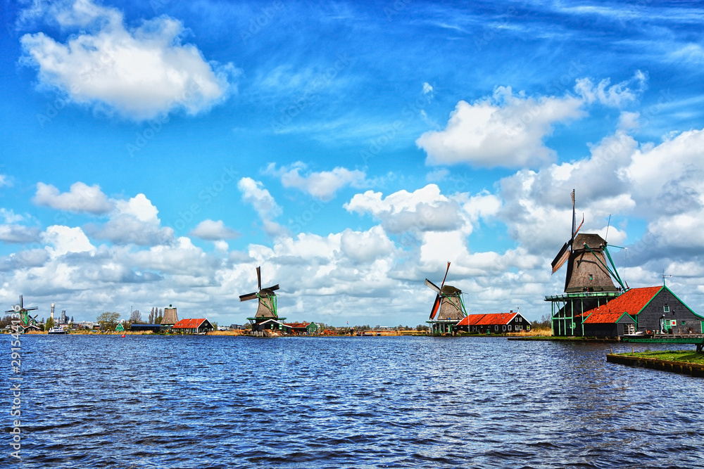 Traditional Holland's wooden windmills, symbol of Netherlands in a charming dutch village Zaanse Schans near Amsterdam