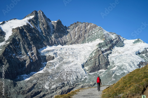 A man hiking under glacier in the alps