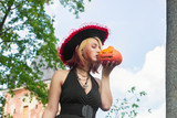 witch kisses a skull pumpkin halloween celebration horror