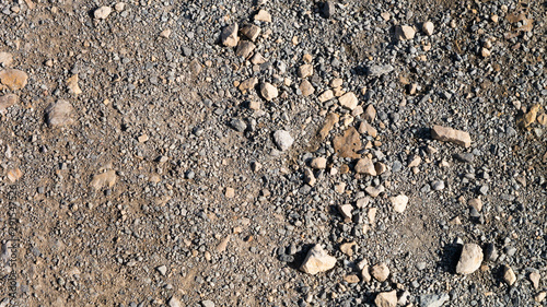 Loose stone aggregate texture featuring large and small stones on a gravel type background. photo
