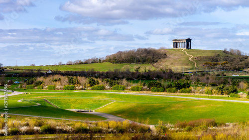 Penshaw Monument located on Penshaw Hill in Sunderland.  Scene shows Penshaw Monument in the background with the beautiful landscape of Herrington Country Park in the foreground.