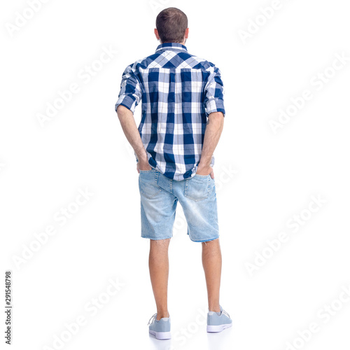 Man in jeans shorts, casual clothing standing looking on white background isolation, rear view