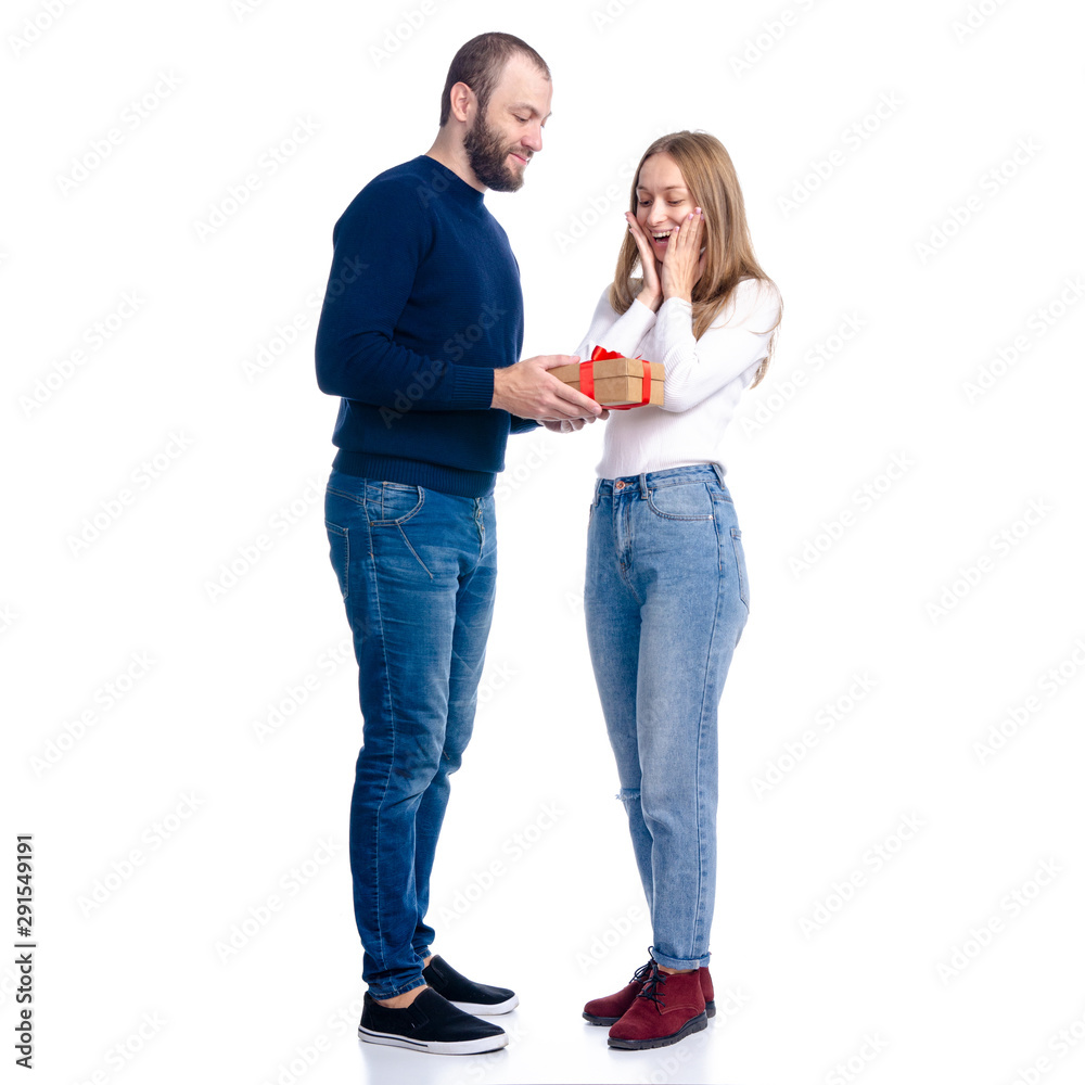 Beautiful romantic couple woman and man with gift box on white background isolation Beautiful romantic couple woman and man with gift box on white background isolation