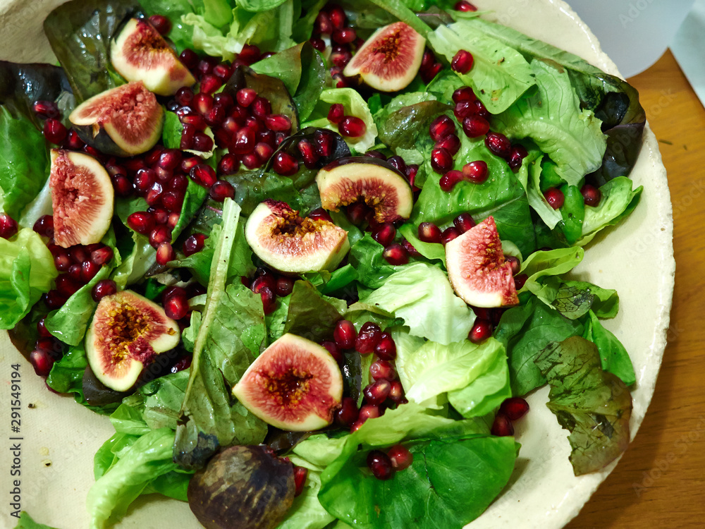 Healthy eating ! Fresh green Salad with figs and pomegranate