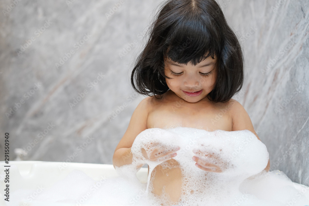 Asian baby kid bathing concept. adorable girl in bathtub with fluffy soap bubble. Asian baby kid bathing concept. adorable girl in bathtub with fluffy soap bubble.