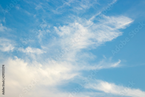 Abstract blurred background Blue sky with white clouds in sunlight.