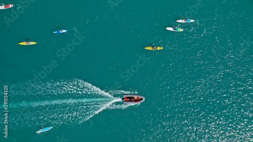 Aerial bird's eye view photo taken by drone of stand up paddle surfers in annual SUP crossing competition in Corinth Canal, Greece © aerial-drone