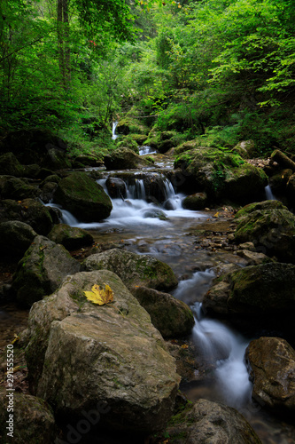 Waterfall in Autumn forest. Beautiful nature background from austria