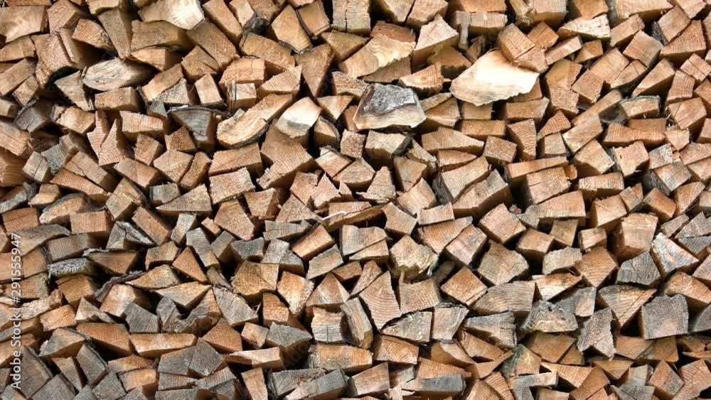 Chopped firewood background. Stacked dry firewood close up. Natural wooden background. Chopped firewood background. Stacked dry firewood close up. Natural wooden background.
