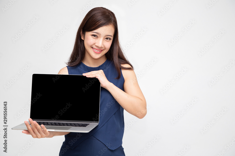 Young Asian woman showing a laptop computer isolated on white background. Presenting application or website products online concept Young Asian woman showing a laptop computer isolated on white background. Presenting application or website products online concept
